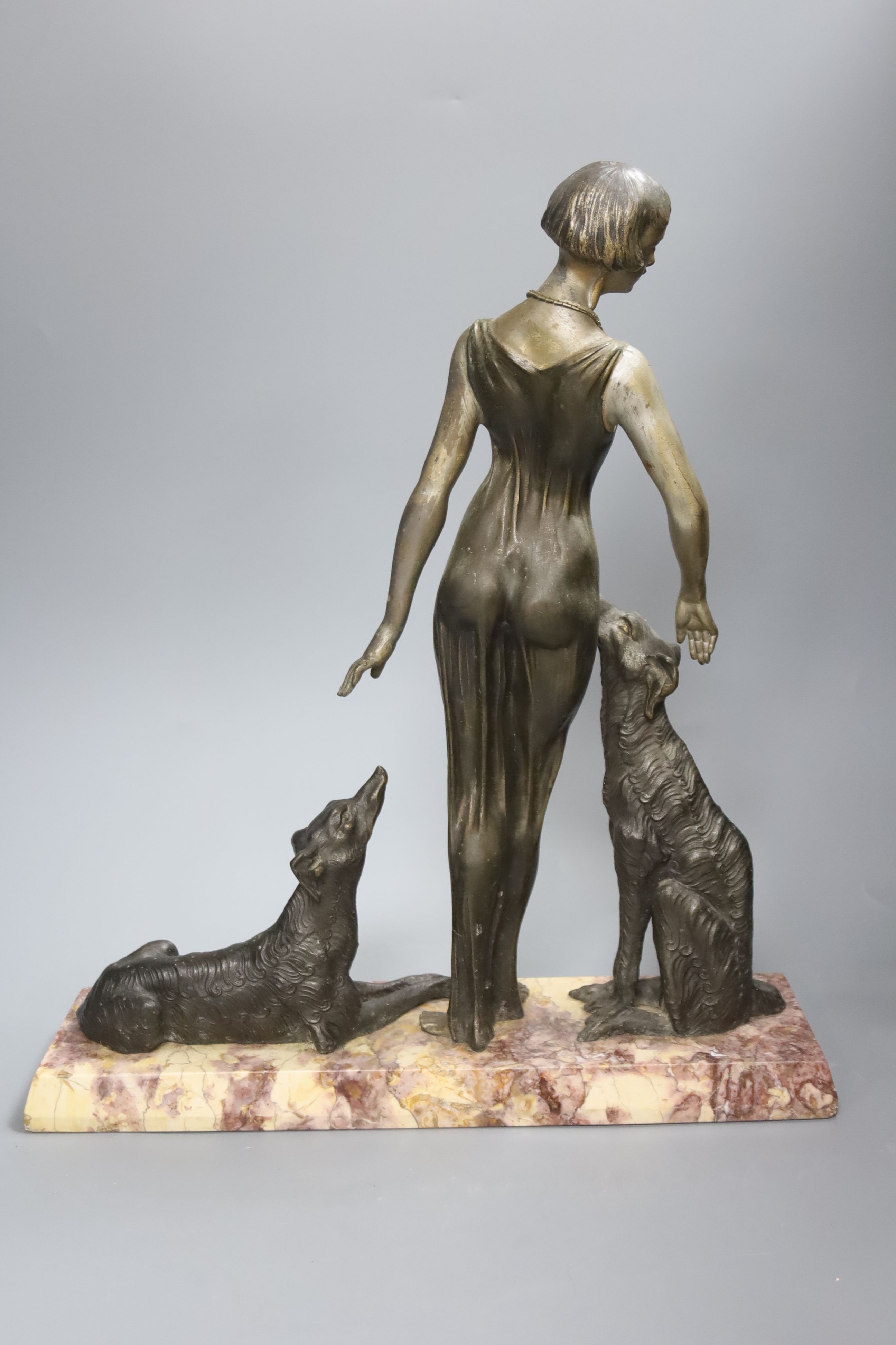 A Spelter Art Deco figure of a dog and borzoi, on a marble base, height 45cm